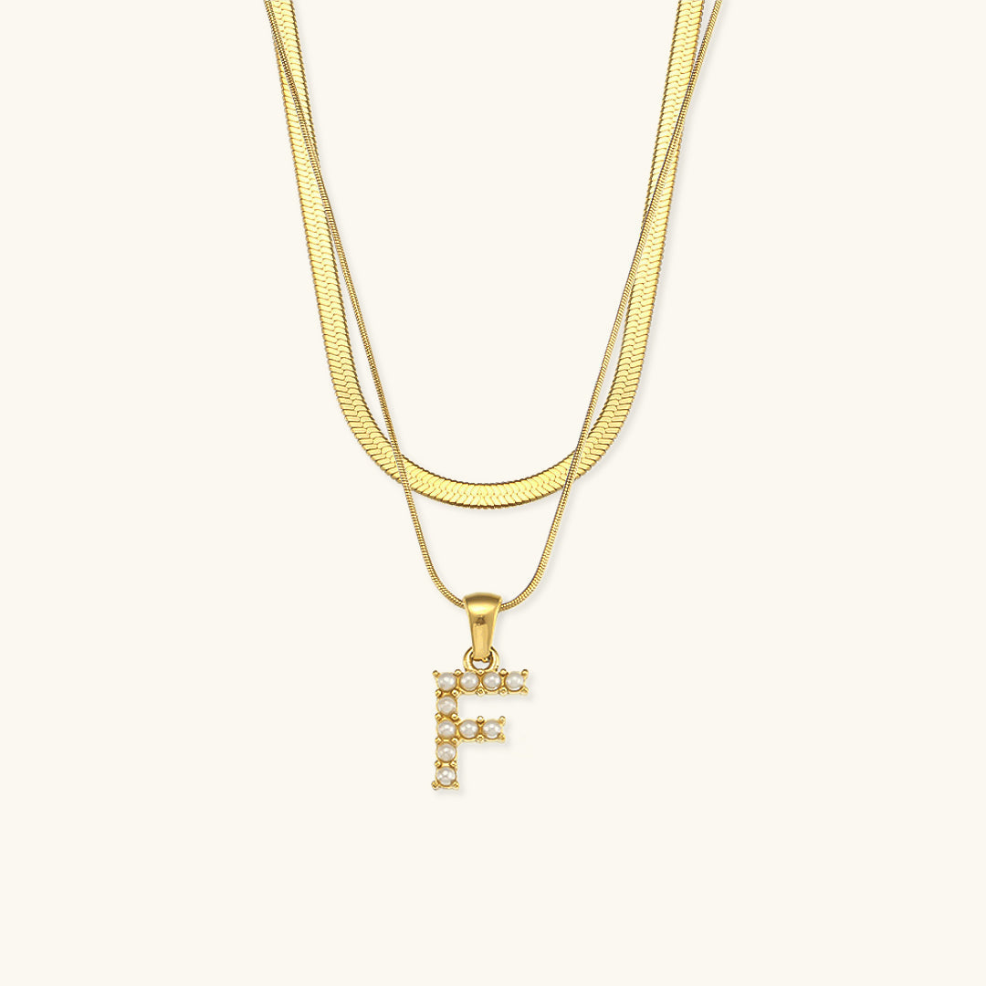 Fiona Lagd Gull Initialhalskjede" could be rewritten as "Fiona Gold Initial Necklace.